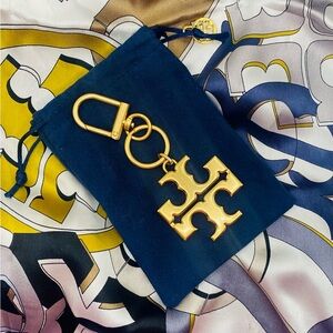 Gold Logo Keychain with Blue Pouch